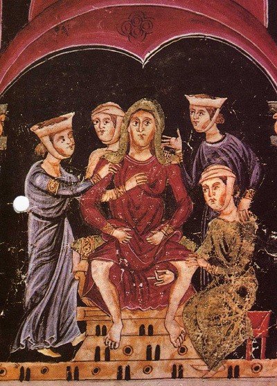 Miniatura medieval que mostra una llevadora rodejada de dones que volen ajudar