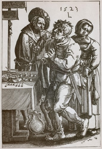 Fauchard en un acte professional. Exhibeix sobre una taula auxiliar l'instrumental necessari pel dentista