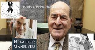 El Dr. Heimlich fent publicitat del llibre on explica la seva maniobra i les varietats de la mateixa, amb el malalt dret, assegut, sense ningú que el pugui ajudar, en el lactant.